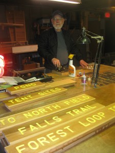 Brian Hudson worked on new trail signs this spring